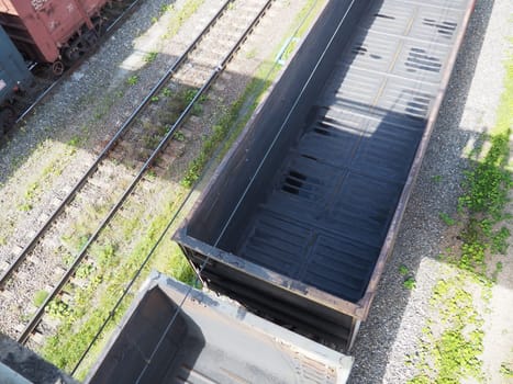 Svir, Russia August 6, 2021. Freight trains and wagons from above. Railroad on a summer day. Transportation, cargo, logistics and business process. Empty metal wagons. International cargo transport.