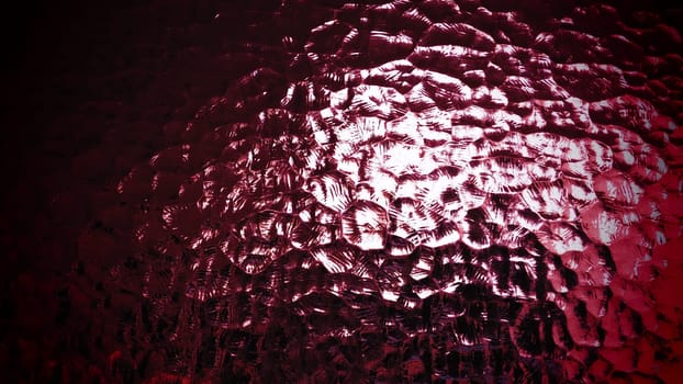beautiful burgundy corrugated glass with a light and dark background. reflections of light.