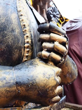 Ancient metal armor, iron detail. Armor, Safety weapon - in antiquity and the Middle Ages, a warriors safety weapon to protect different parts of the body, a piece of forged metal or a kit. Imitation