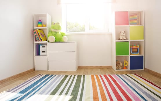 Comfortable room with colourful furniture in sunny day. Concept of the child room and kindergarten.
