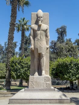 Statue of pharaoh Ramses in Memphis was the capital of the Old Kingdom of Egypt. The ruins of the city are located 19 km south of Cairo, on the west bank of the Nile.