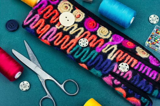 Set sewing kit, scissors, threads, needles and colorful thread. Needlework concept. Top view, flat lay