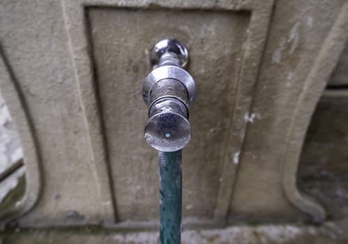 Detail of water tap in the street, drinking water