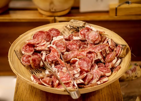 Many bites with cheese and ham in a tapas bar.