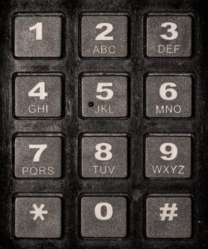 A detail of a keyboard with the numbers from 0 to 9 and the alphabet.