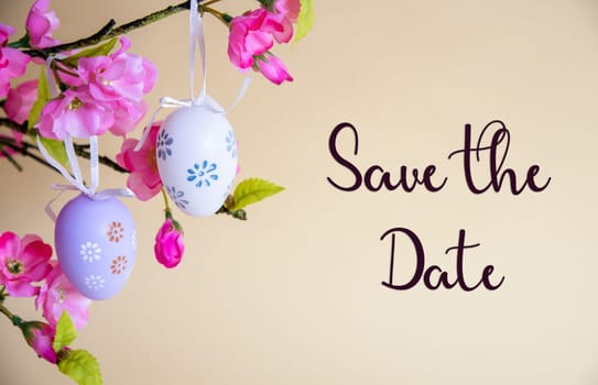 Beautiful Easter Egg Decoration With Spring Flowers. English Text Save The Date. Seasonal Easter Holiday Greeting Card.