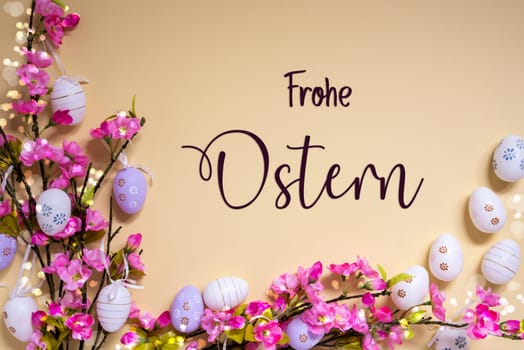 German Text Frohe Ostern Means Happy Easter On Beige Background. Pink And Purple, Shiny And Bright Spring Flower Arrangement With Easter Egg Decoration.