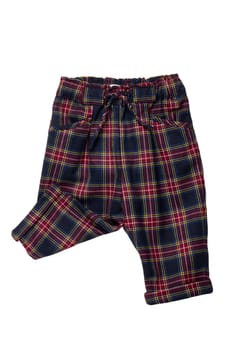 Summer shorts isolated. Close-up of a stylish fashionable plaid short pants with elastic and bow. Clipping path.Tartan checkered fabric texture background.