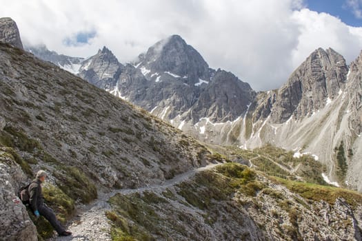 man trekking in the mountains, Alps in Austria, Lienzer Dolomiten, East Tyrol