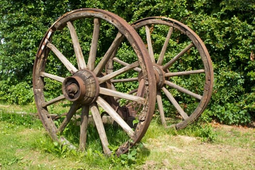 Rural wagon wheels in a garden - close up