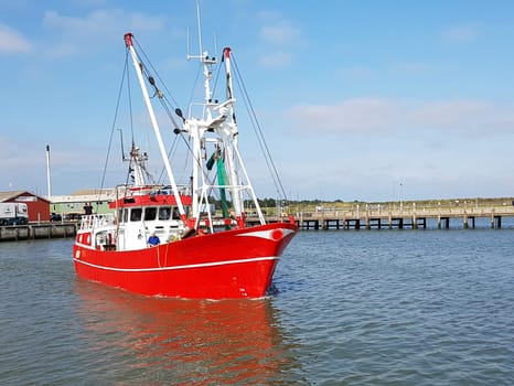 Fishing boat in the harbour of the island of Roemoe in Denmark. Fishing boat in the harbor of Roemoe island in Denmark.