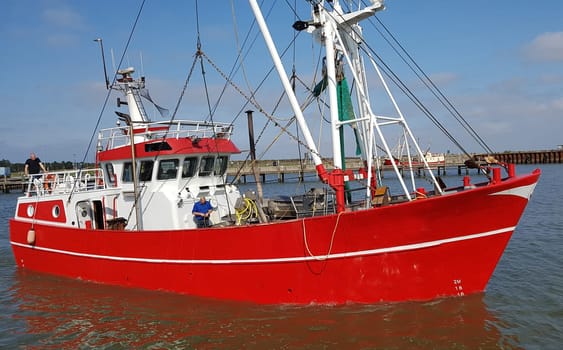 Fishing boat in the harbour of the island of Roemoe in Denmark. Fishing boat in the harbor of Roemoe island in Denmark.