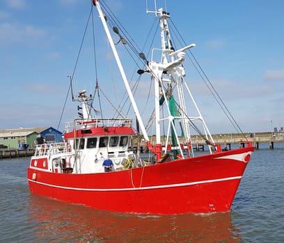 Fishing boat in the harbour of the island of Roemoe in Denmark. Fishing boat in the harbor of Roemoe island in Denmark.