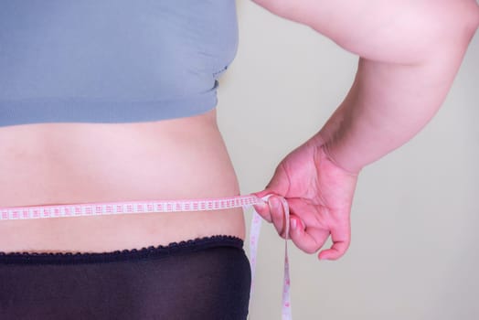 Fat woman, Shape up healthy stomach muscle, and diet lifestyle, to reduce belly concept.
