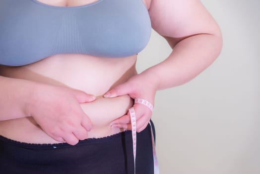 Fat woman, Shape up healthy stomach muscle, and diet lifestyle, to reduce belly concept.