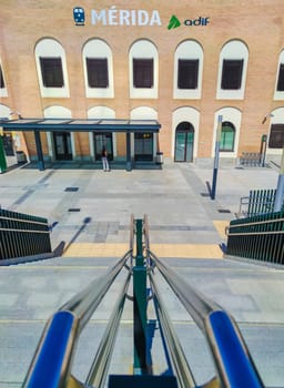 Merida, Spain - Setp 18th, 2021: Merida train station stairs access. Chrome handrails