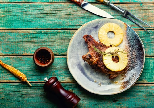 Fresh delicious grilled pork chop steak with roasted pineapple