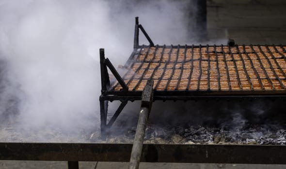 Detail of fire roasted pork, traditional festival