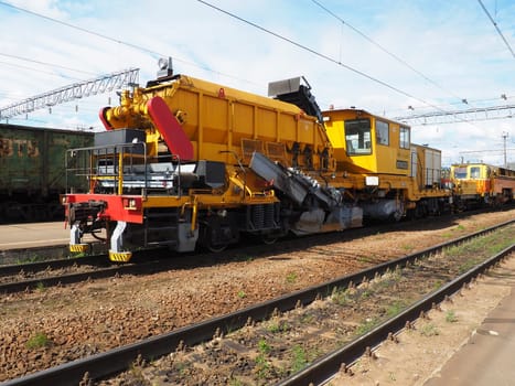 Svir Russia August 6 2021 Train serving the railroad, snow and wood cutting steel nozzles. Special transport of the Russian Railways. Locomotive with equipment for cleaning, reconstruction and repair.