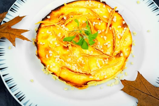 Baked casserole with pumpkin and cottage cheese. Autumn baking with pumpkin.