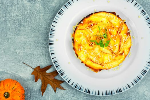 Baked casserole with pumpkin and cottage cheese. Autumn baking with pumpkin.