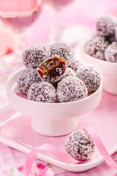 Energy protein balls with healthy ingredients, made with dates, peanut butter, flax and chia seeds, oats, almond and chocolate drops