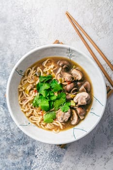 Asian vegan miso ramen noodle soup with mushrooms, onions and cilantro