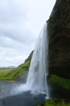 Seljalandsfoss falls in summer season view, Iceland. Icelandic landscape.