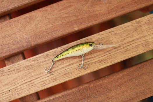 artificial small fish with sharp fishing hooks is a wobbler for catching predatory fish