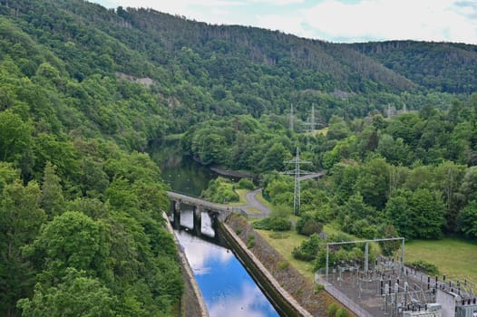 View from the Edertalsperre to the river Eder with power poles