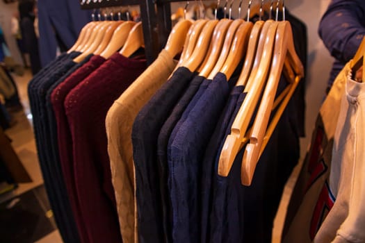 Clothes on hangers in a clothing store, close-up