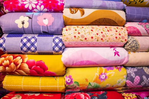 Artistic variety shade tone colors Bed sheets stacked on retail Shop Shelf to sale