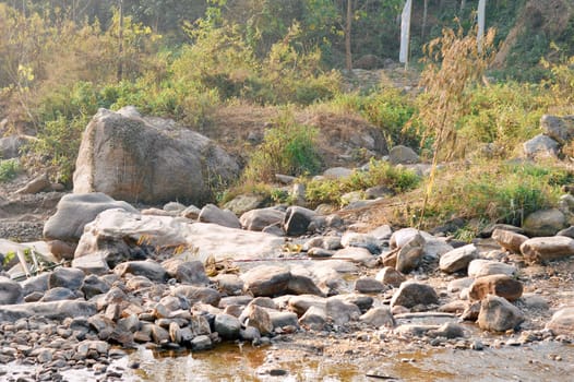 Large Igneous River Boulders and rocks has been carried by the river on the remote mountain place. Rangbang river mountain valley.Tabakoshi West Bengal India
