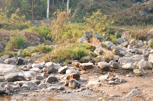Large Igneous River Boulders and rocks has been carried by the river on the remote mountain place. Rangbang river mountain valley.Tabakoshi West Bengal India