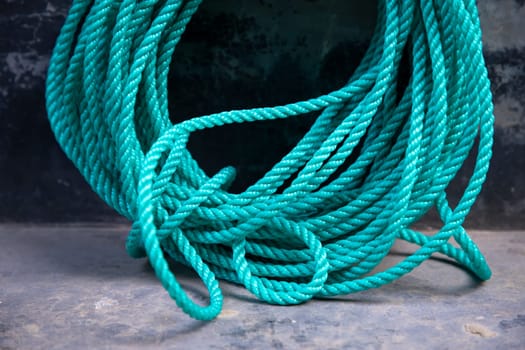 green rope tied up on the dock of the ship, stock photo