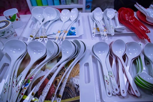 Plastic spoons and other utensils for sale in the market