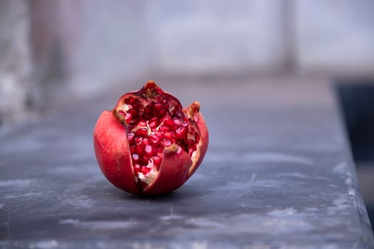 Ripe pomegranate fruit on a black background. Healthy food