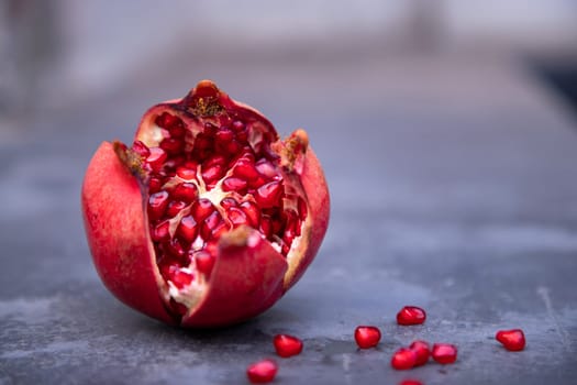 Pomegranate fruit on a dark background. Selective focus.