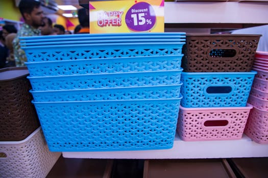 Colorful plastic baskets for sale in a market