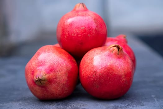 Ripe pomegranates on a dark background. Selective focus