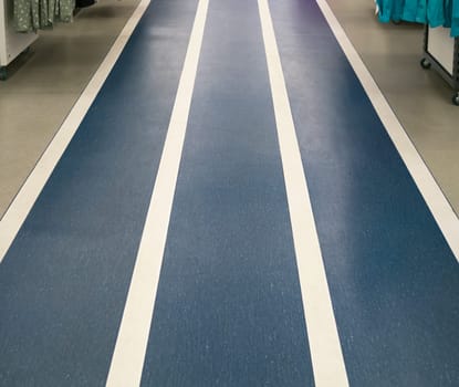 Three-lane track denim color on the floor in a spacious room