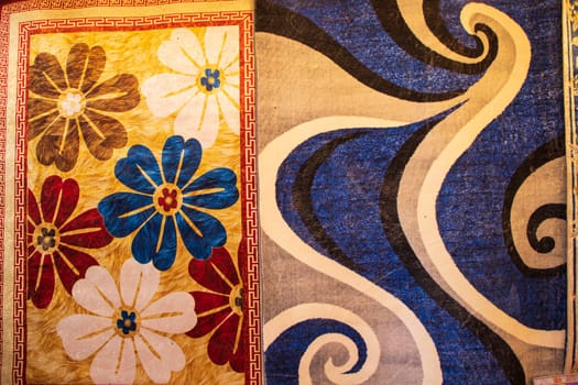 Colorful paintings carpets on display at the bazaar in Istanbul, Turkey