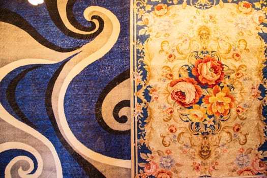 Colorful paintings carpets on display at the bazaar in Istanbul, Turkey