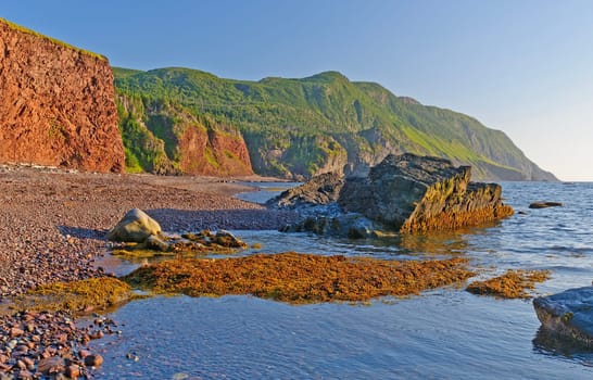 Green Hills Above a Rocky Beach in the Green Gardens of Gros Morne National Park in Newfoundland