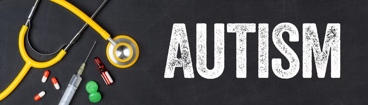 Stethoscope and pharmaceuticals on a blackboard - Autism