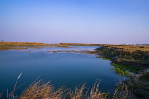 Crystal clear blue water lake landscape view nearby Padma river in Bangladesh