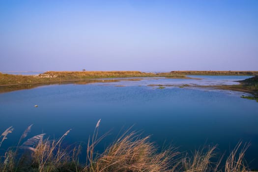 Crystal clear blue water lake landscape view nearby Padma river in Bangladesh