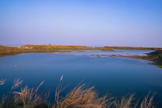 Crystal clear blue water lake landscape view nearby Padma river in Bangladesh