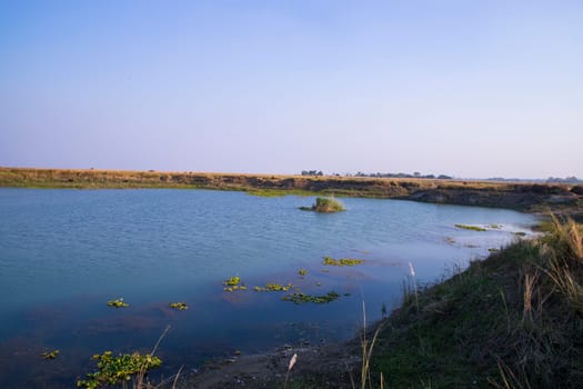 Crystal clear blue water lake landscape view nearby Padma river in Bangladesh
