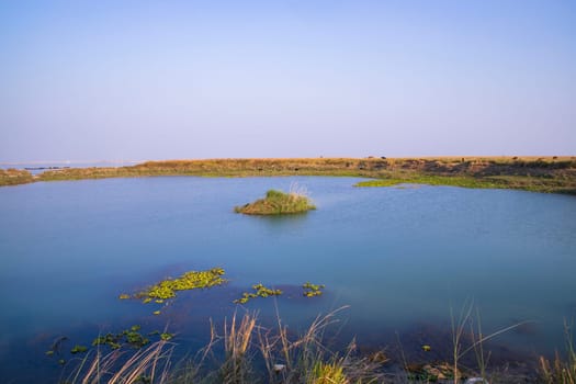 Crystal clear blue water lake landscape view nearby Padma river in Bangladesh
